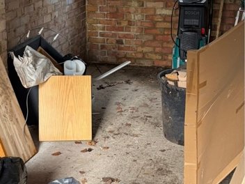 Garage full of clutter before a Home Care Utility clearance